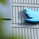 The Twitter logo is seen on a sign on the exterior of Twitter headquarters in San Francisco, California, on October 28, 2022.